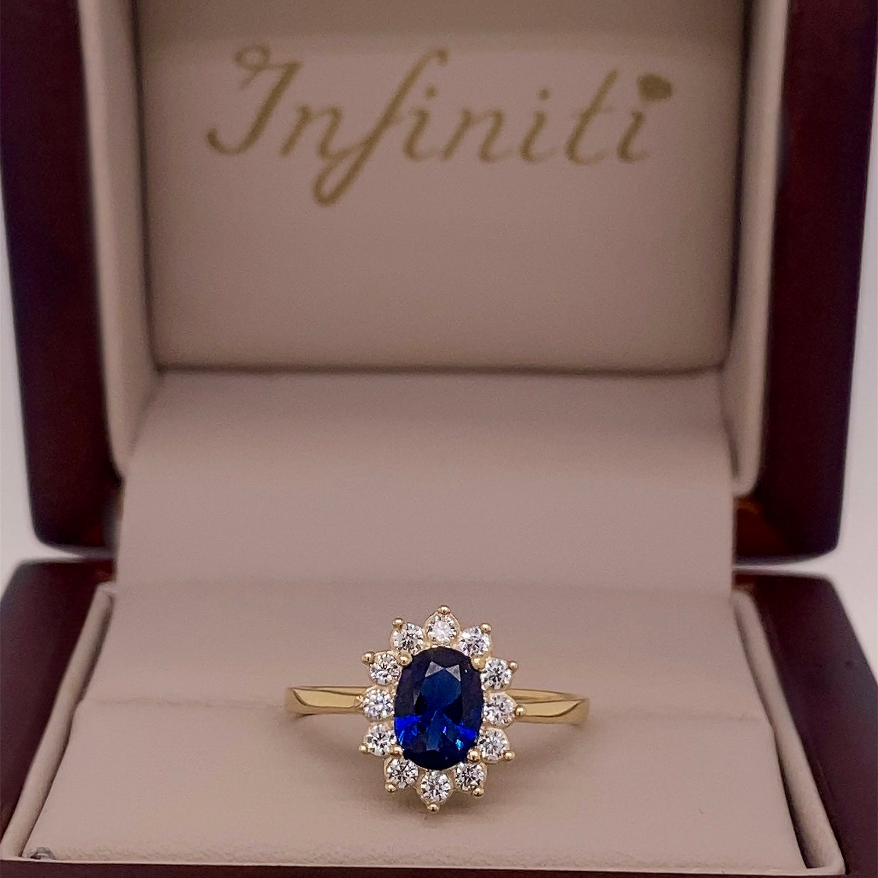 Anillo Oro 10k, Halo con Zafiro Sintético 7x5 mm