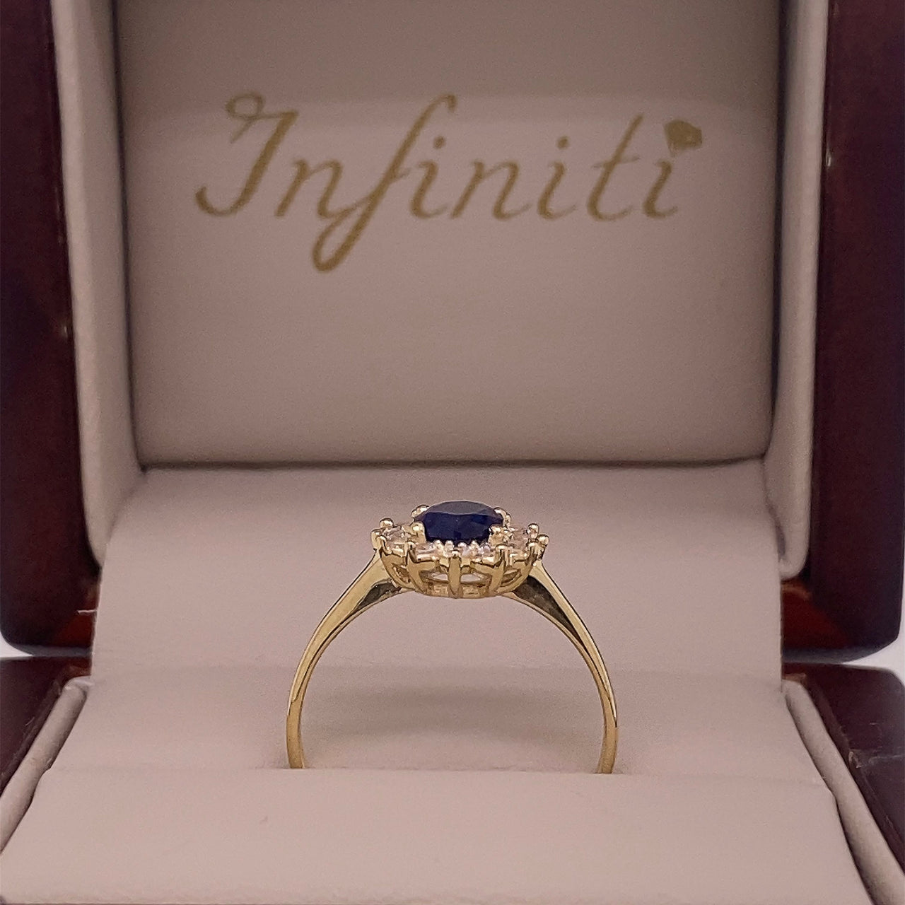 Anillo Oro 10k, Halo con Zafiro Sintético 7x5 mm