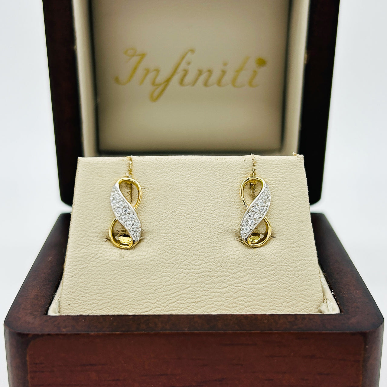 Arete Oro 10k - Infinito con Zirconia
