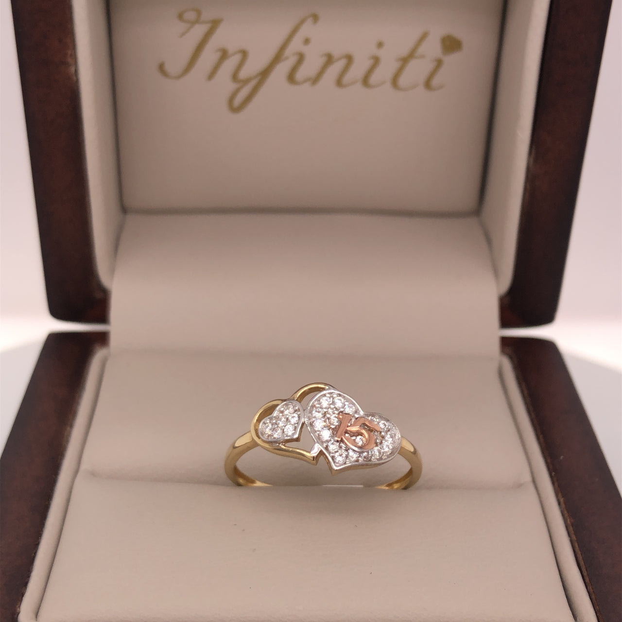 Anillo Oro 10k, con Doble Corazón con Zirconias y 15 en Oro Rosa