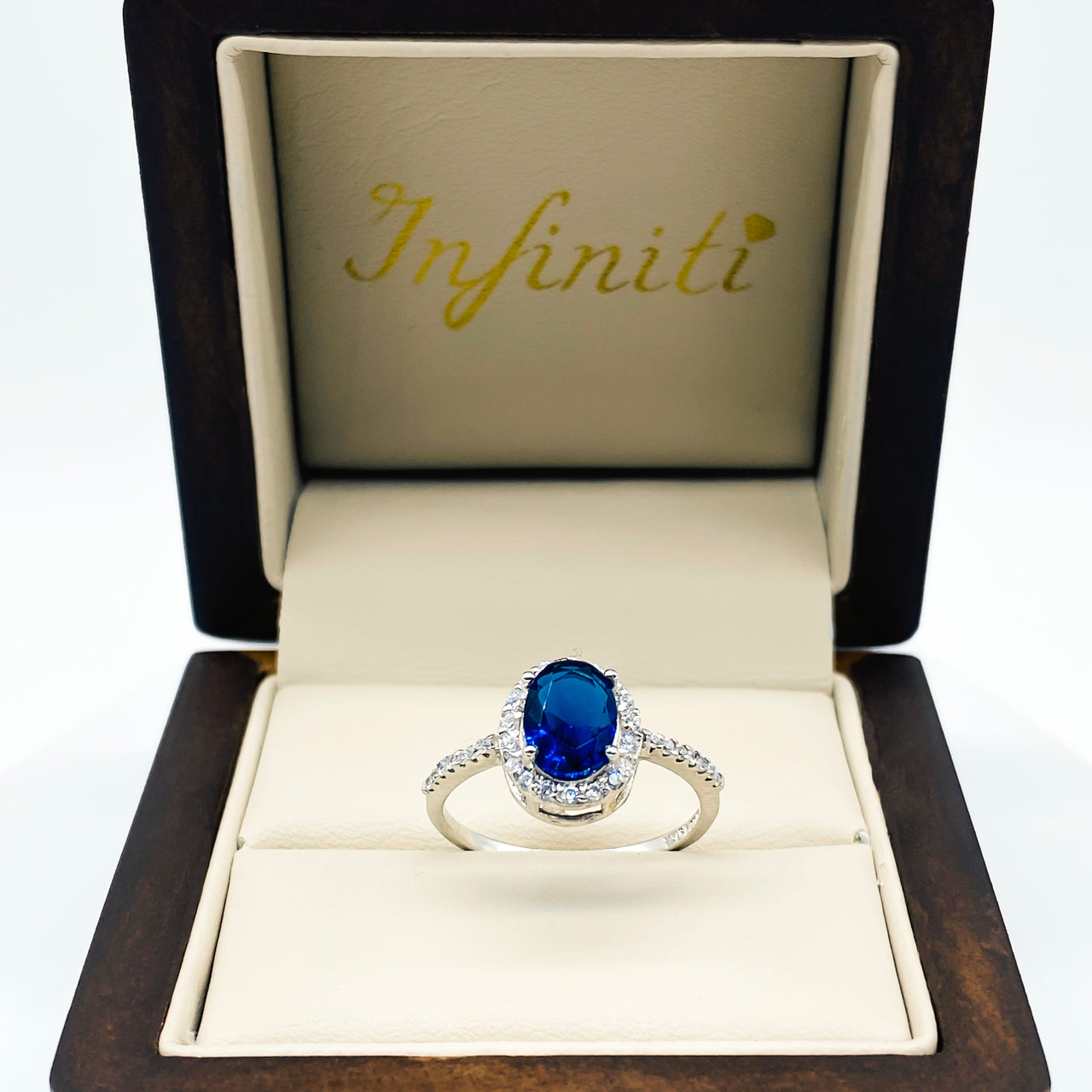 Anillo Oro Blanco 14k - Halo Zafiro Zirconia con Laterales