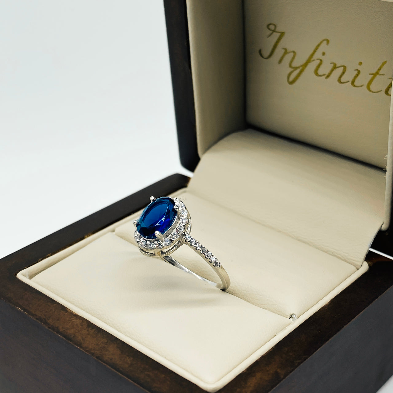 Anillo Oro Blanco 14k - Halo Zafiro Zirconia con Laterales