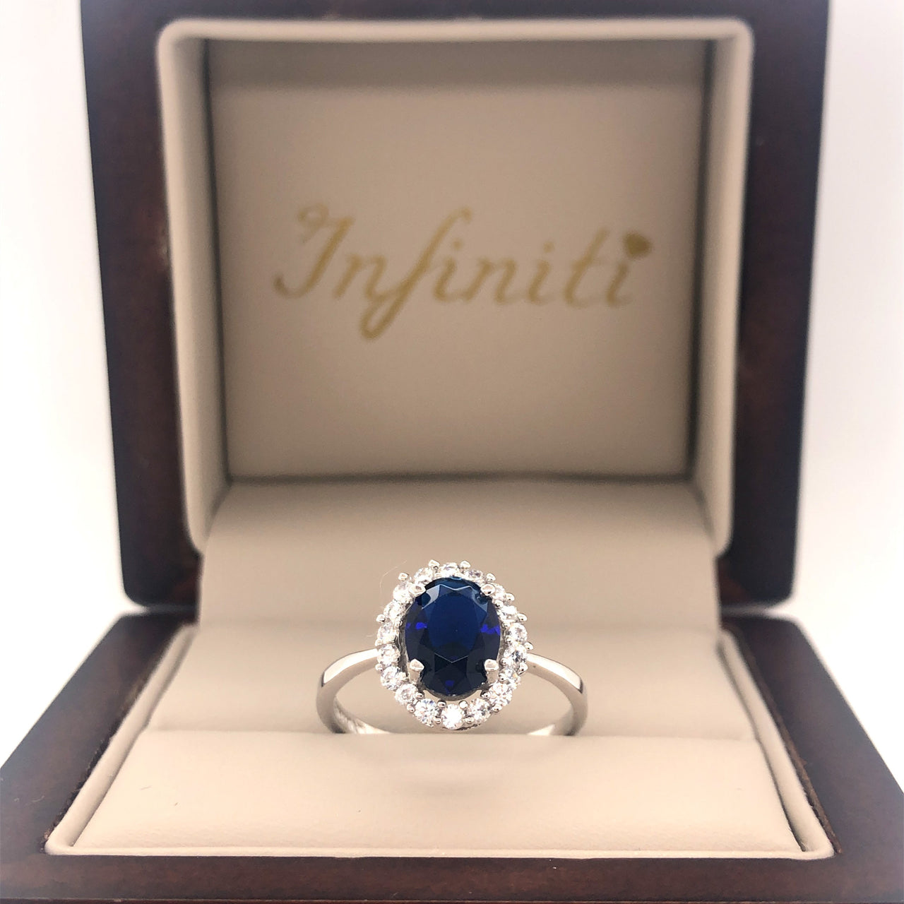 Anillo Oro Blanco 10k, Halo con Zafiro 8x6 mm - Infiniti Joyas