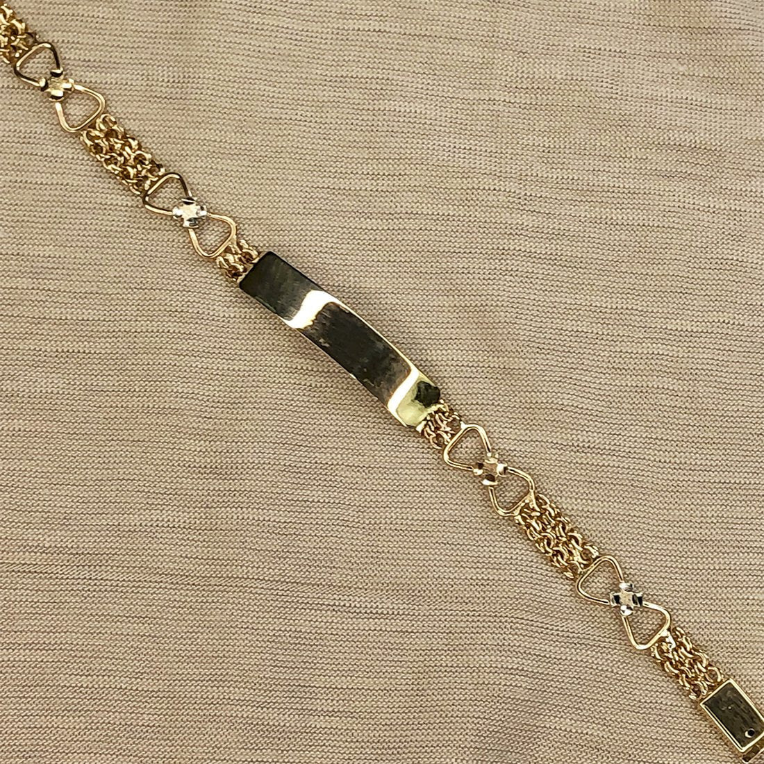 Esclava China Oro 10k con moños, 15 cm Largo, Ancho 6 mm, Oro 10k - Infiniti Joyas
