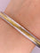 Aro Ovalado Oro 10k, Acabado Diamantado orillas platinadas, 6.5 cm Diámetro, Ancho 7 mm